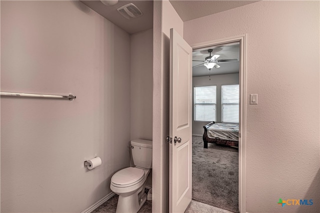 bathroom featuring toilet and ceiling fan