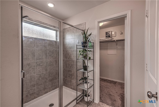 bathroom featuring an enclosed shower