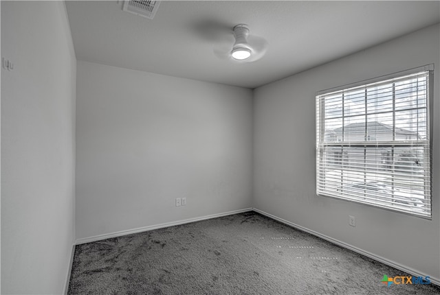 carpeted empty room featuring ceiling fan