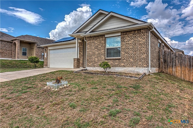 view of front of home with a garage and a front yard