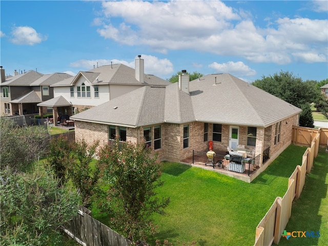 rear view of house featuring a gazebo, a yard, a patio, and an outdoor hangout area