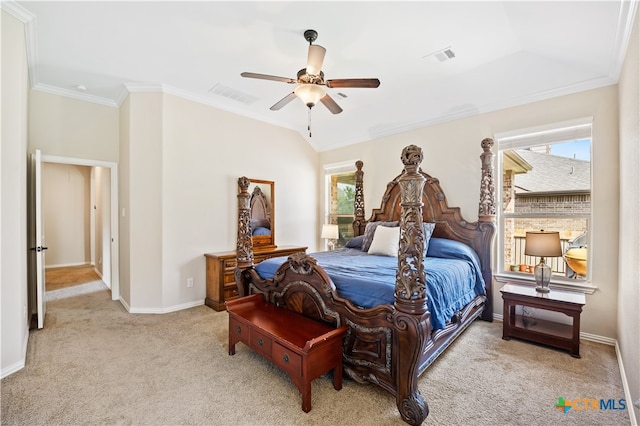 carpeted bedroom with ceiling fan and ornamental molding