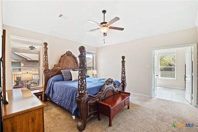 bedroom featuring light carpet, multiple windows, and ceiling fan