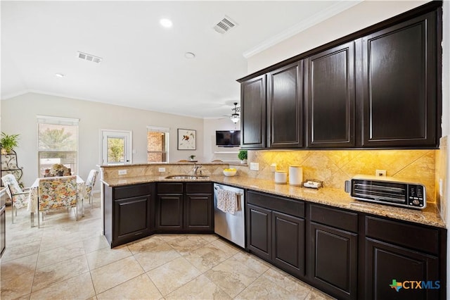 kitchen with sink, stainless steel dishwasher, ceiling fan, light stone counters, and kitchen peninsula