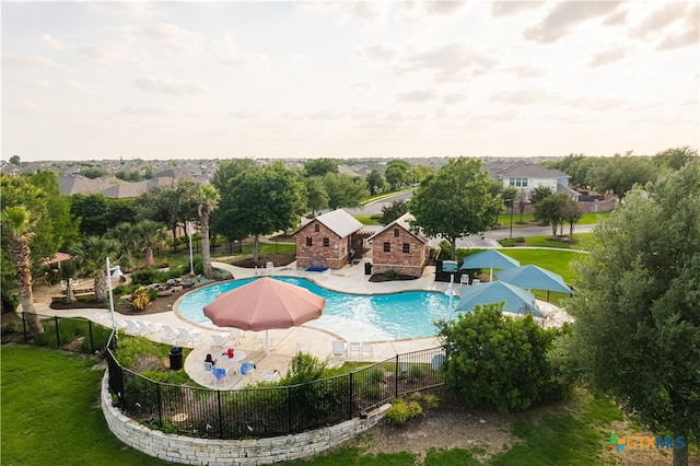 view of pool featuring a yard