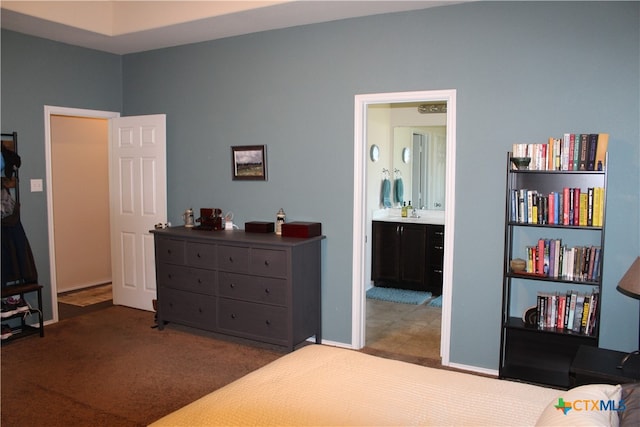 carpeted bedroom with ensuite bath