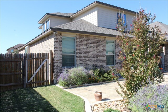 view of home's exterior with a yard