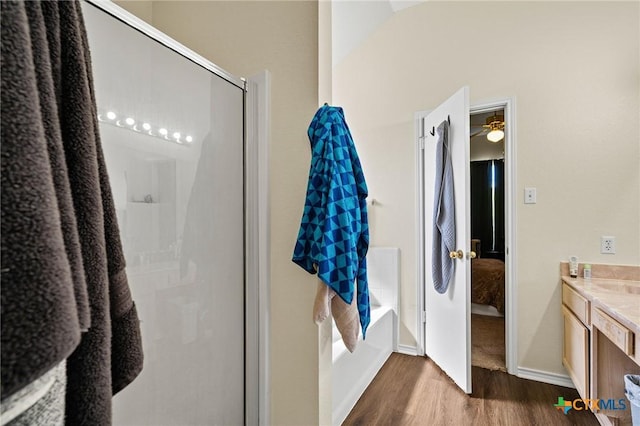 1801 Caprock Dr, Killeen, TX 76549 - ensuite bathroom featuring wood finished floors, vanity, a stall shower, and a garden tub