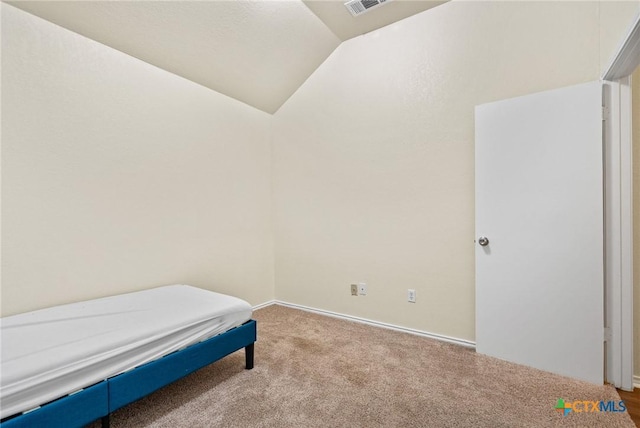 1801 Caprock Dr, Killeen, TX 76549 - bedroom with vaulted ceiling and carpet flooring