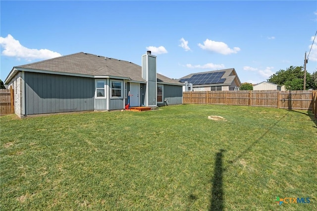 1801 Caprock Dr, Killeen, TX 76549 - back of house with a chimney and a fenced backyard