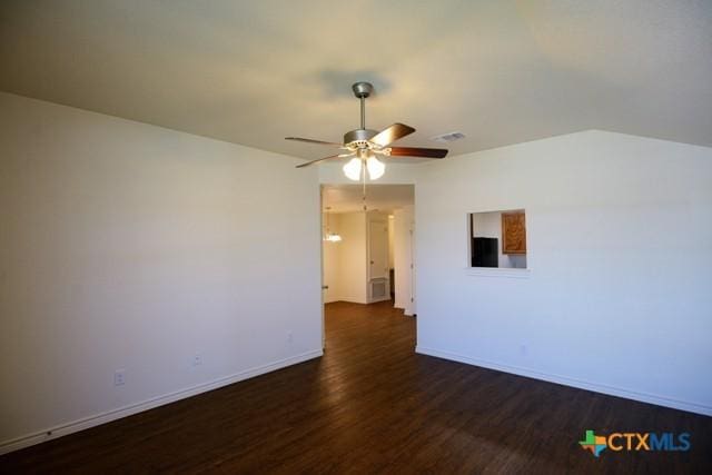 empty room with ceiling fan and dark hardwood / wood-style floors