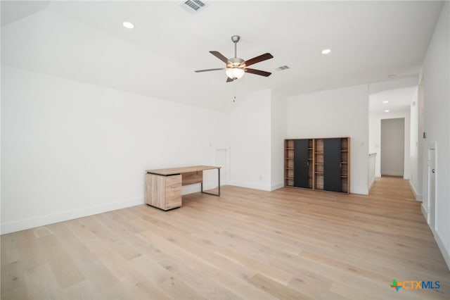 unfurnished living room with ceiling fan and light hardwood / wood-style floors