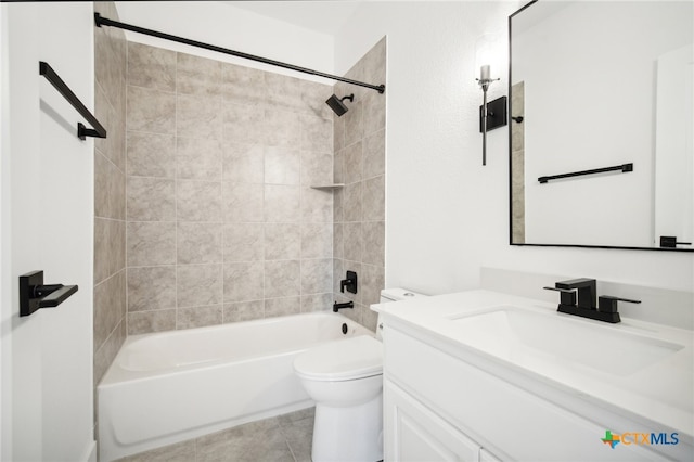 full bathroom with tile patterned flooring, vanity, toilet, and tiled shower / bath combo