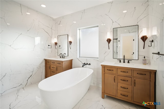 bathroom featuring vanity, a bathing tub, and tile walls