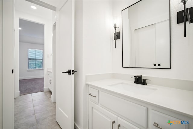 bathroom featuring vanity and tile patterned flooring