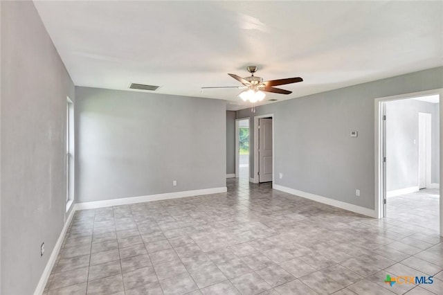 empty room featuring ceiling fan