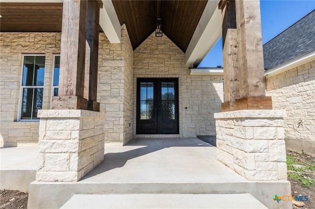 view of exterior entry with stone siding