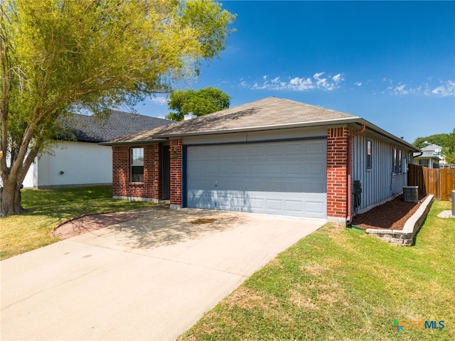 ranch-style home featuring a front lawn, brick siding, board and batten siding, and an attached garage