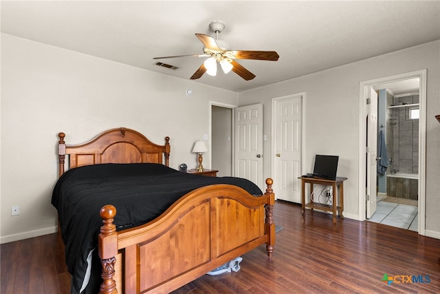 bedroom featuring baseboards, visible vents, dark wood finished floors, and a ceiling fan