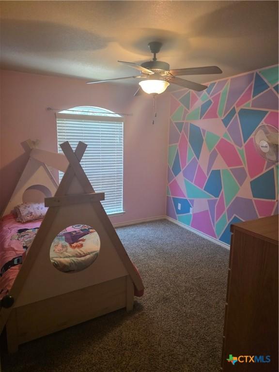 1212 Redstone Dr, Temple, TX 76502 - carpeted bedroom with a ceiling fan and baseboards