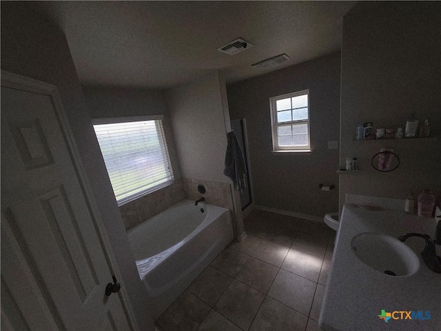 1212 Redstone Dr, Temple, TX 76502 - bathroom featuring a bath, tile patterned floors, and vanity