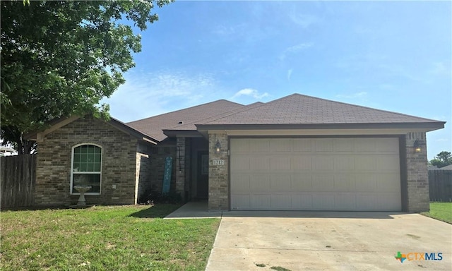 1212 Redstone Dr, Temple, TX 76502 - ranch-style house with brick siding, driveway, and a garage