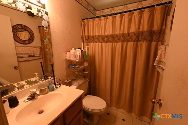807 Hartrick Cir, Temple, TX 76502 - full bath with vanity, a shower with shower curtain, and tile patterned floors