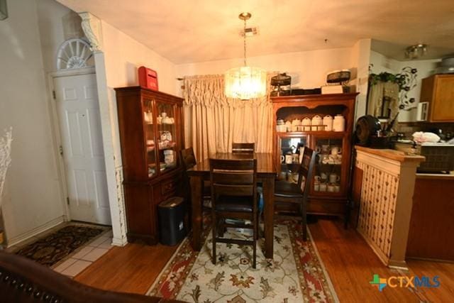 807 Hartrick Cir, Temple, TX 76502 - dining area with a chandelier and wood finished floors