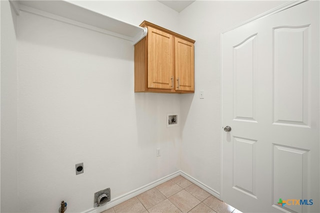 laundry area with hookup for an electric dryer, cabinets, light tile patterned floors, hookup for a gas dryer, and washer hookup