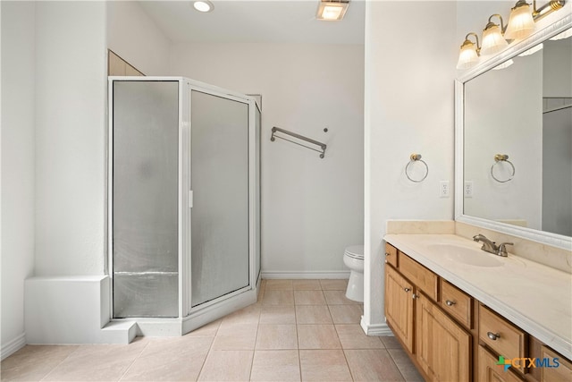 bathroom featuring vanity, tile patterned floors, an enclosed shower, and toilet