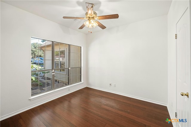 empty room featuring hardwood / wood-style floors and ceiling fan