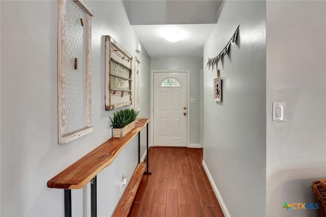 104 Majestic Ln, Victoria, TX 77904 - doorway to outside with wood finished floors and baseboards