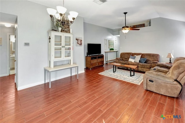 104 Majestic Ln, Victoria, TX 77904 - living room featuring wood finished floors, lofted ceiling, a ceiling fan, and a chandelier