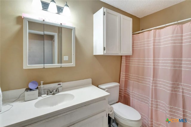 104 Majestic Ln, Victoria, TX 77904 - full bathroom with vanity, a textured ceiling, and a shower with shower curtain