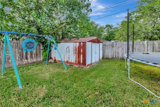 104 Majestic Ln, Victoria, TX 77904 - fenced backyard featuring a trampoline and a shed