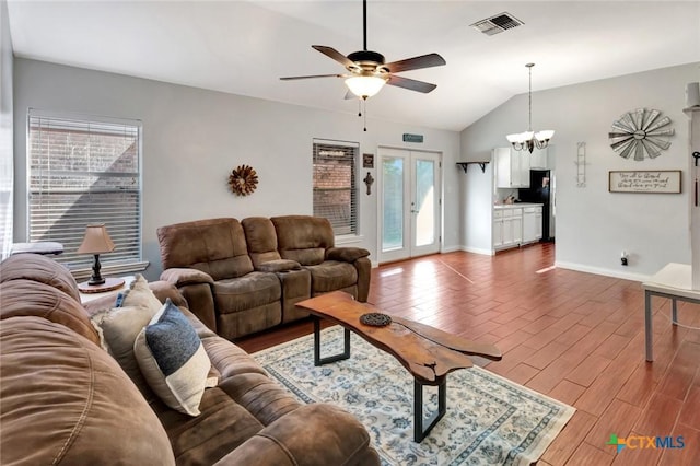 104 Majestic Ln, Victoria, TX 77904 - living area featuring lofted ceiling, ceiling fan, a chandelier, and wood finished floors