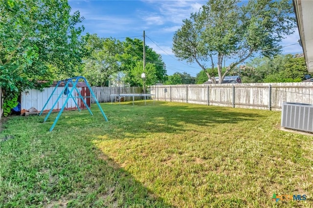 104 Majestic Ln, Victoria, TX 77904 - fenced backyard featuring a trampoline and a playground