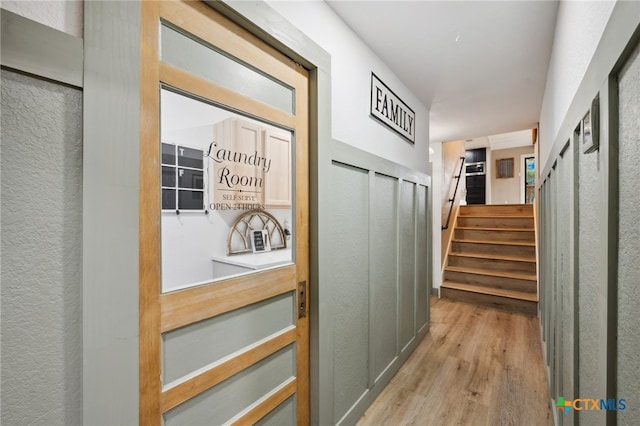 hall with light hardwood / wood-style floors