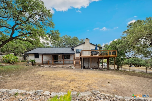 rear view of house with a deck