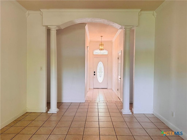 3900 Chisholm Trl, Salado, TX 76571 - entrance foyer featuring crown molding, light tile patterned flooring, baseboards, and arched walkways