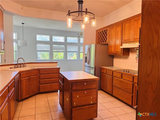 3900 Chisholm Trl, Salado, TX 76571 - kitchen with a sink, under cabinet range hood, brown cabinets, ornamental molding, and a kitchen island