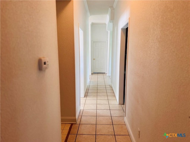 3900 Chisholm Trl, Salado, TX 76571 - corridor featuring light tile patterned flooring, ornamental molding, and baseboards