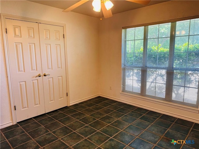 3900 Chisholm Trl, Salado, TX 76571 - empty room featuring dark tile patterned flooring and a ceiling fan