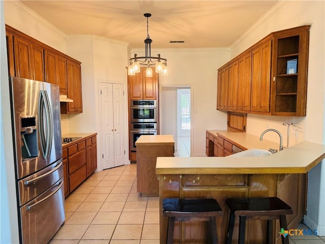 3900 Chisholm Trl, Salado, TX 76571 - kitchen with appliances with stainless steel finishes, a peninsula, a sink, light countertops, and light tile patterned floors
