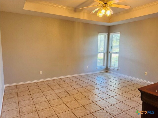 3900 Chisholm Trl, Salado, TX 76571 - empty room with a raised ceiling, ornamental molding, light tile patterned flooring, a ceiling fan, and baseboards