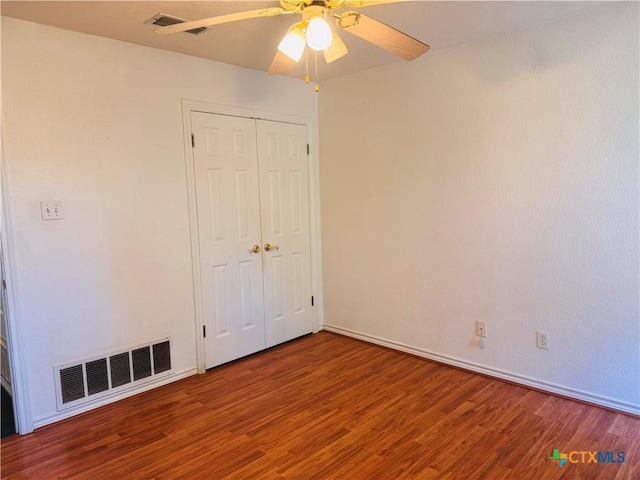 3900 Chisholm Trl, Salado, TX 76571 - unfurnished bedroom featuring wood finished floors, baseboards, a ceiling fan, and a closet