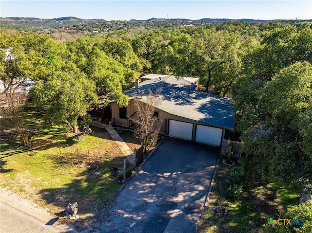 aerial view featuring a wooded view