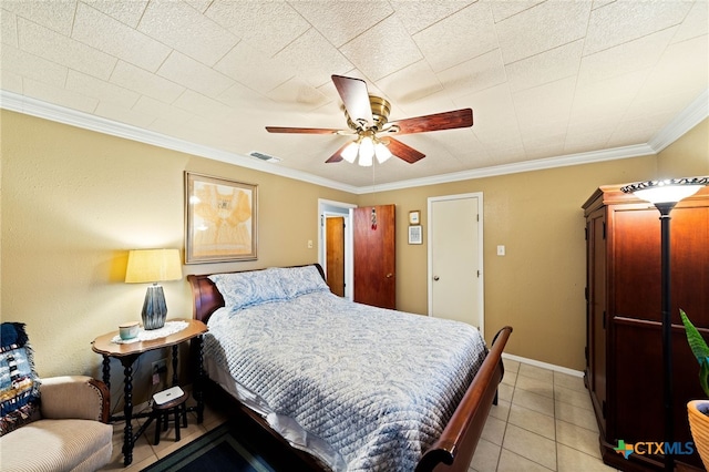 bedroom with light tile patterned floors, baseboards, visible vents, a ceiling fan, and crown molding