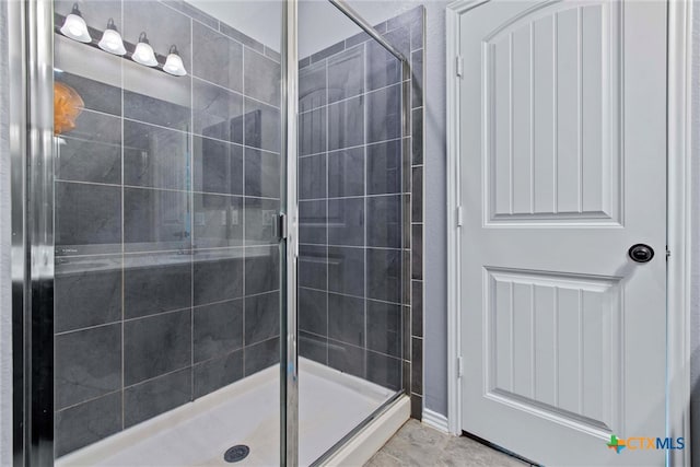 bathroom featuring a shower stall