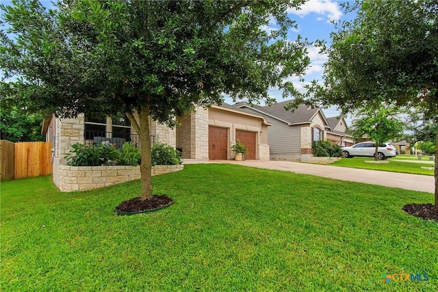 view of front of house with a garage, a front yard, driveway, and fence